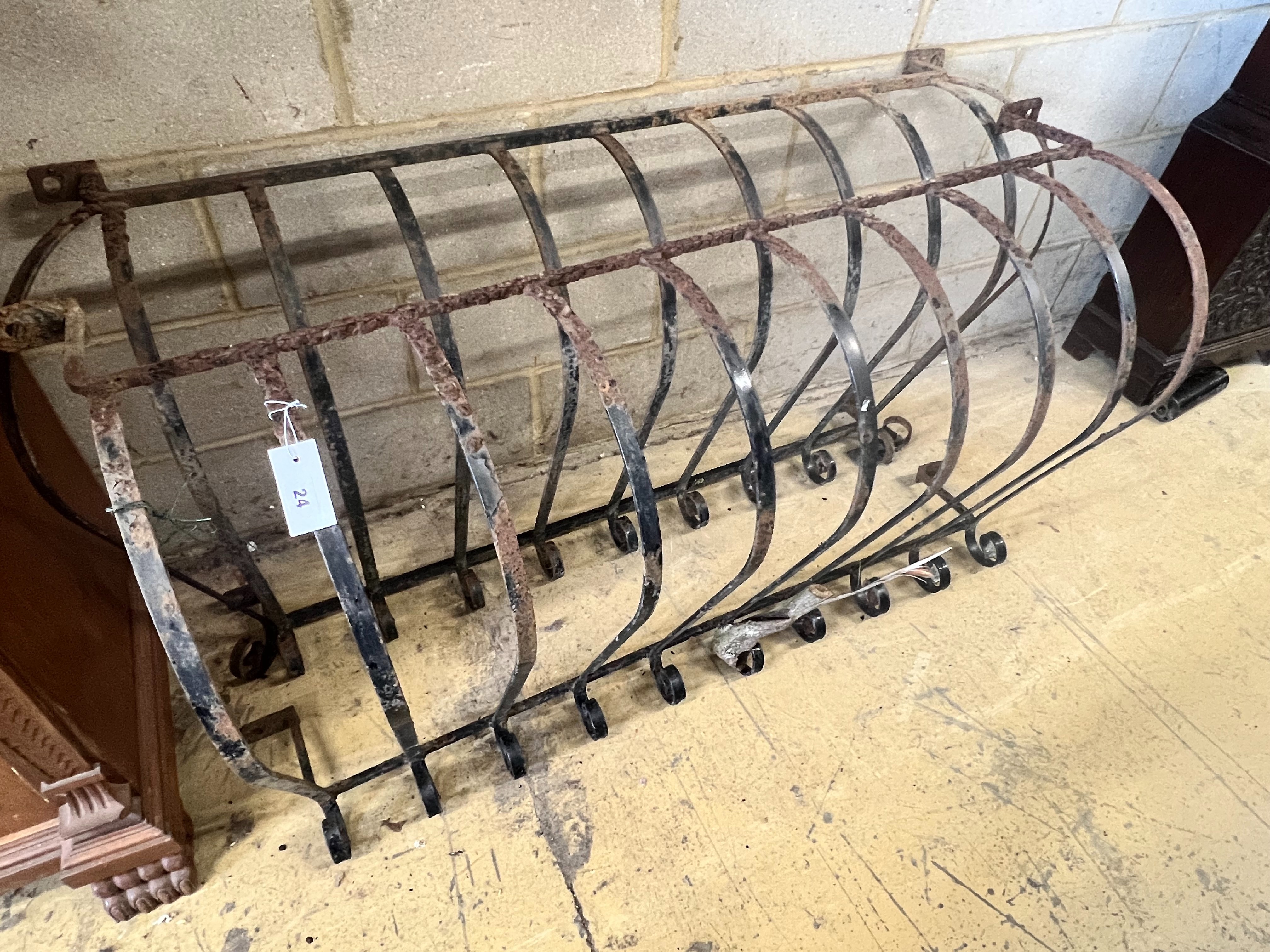 A pair of wrought iron bowfront balcony rails, widest 140cm height 71cm